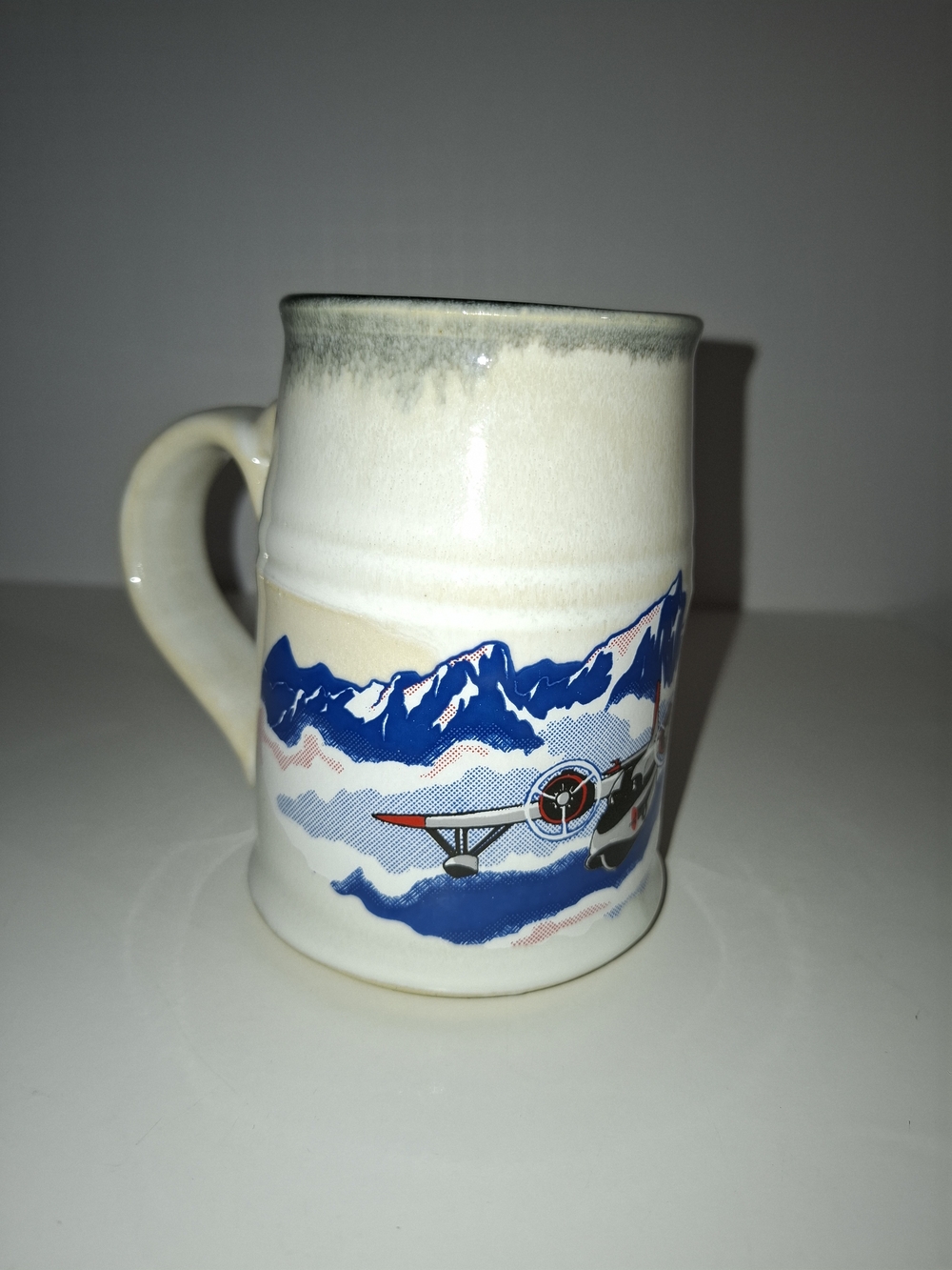 Cream Ceramic Airplane Mug with Blue Mountain Scene - Picture 1 of 5